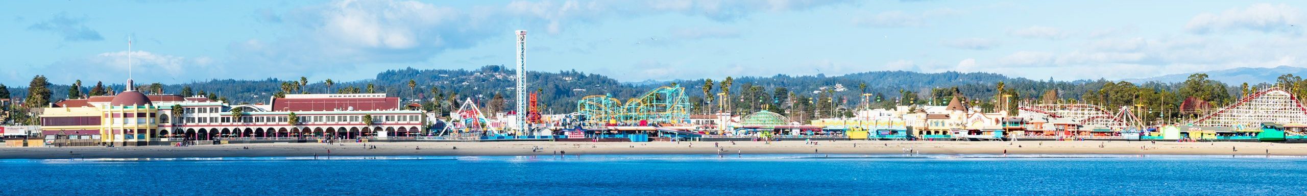 Panoramic view of the historic beach boardwalk with amusement park in Santa Cruz.